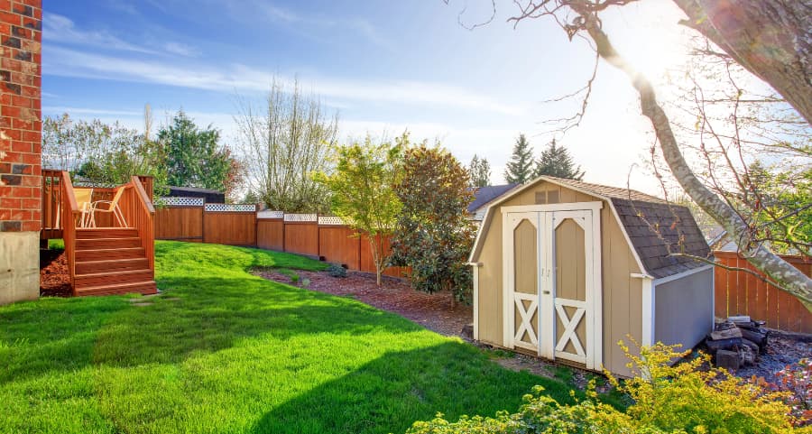 Fenced backyard with storage shed in Kalamazoo